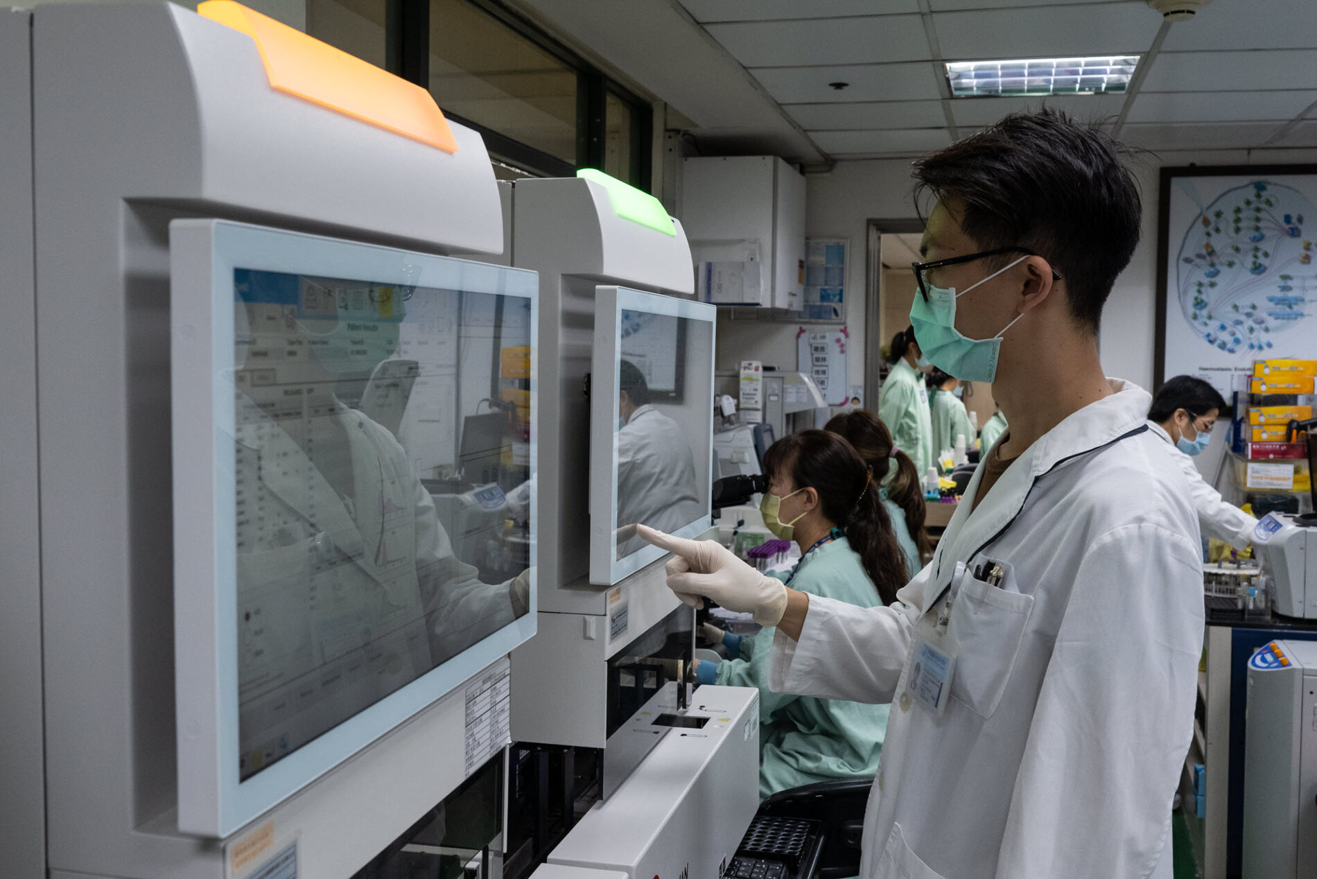 doctor using touchscreen monitor