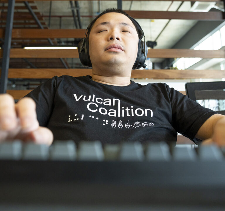 man with eyes closed wearing headphones