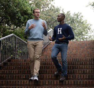 two people walking down stairs