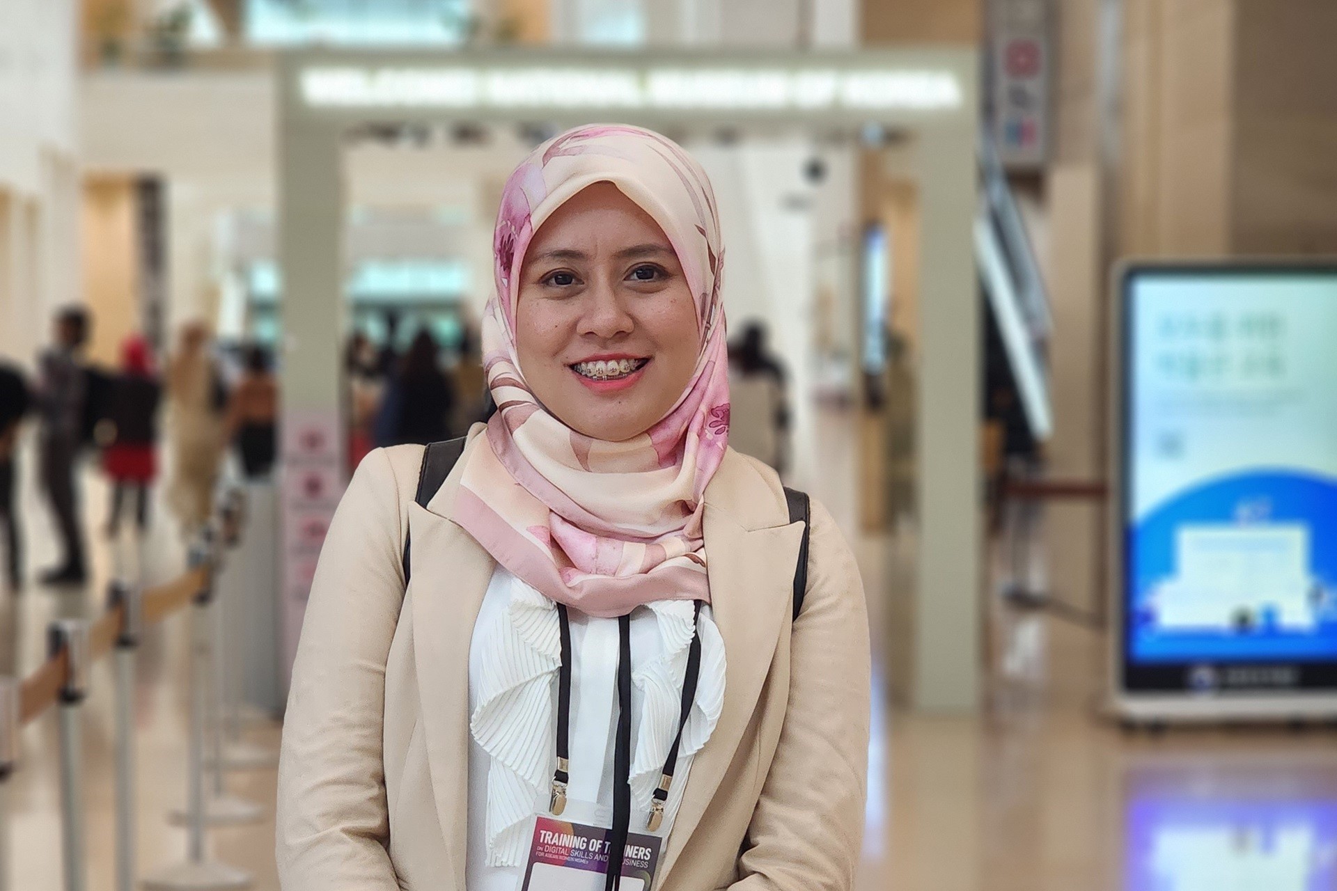 Woman in headscarf at a conference