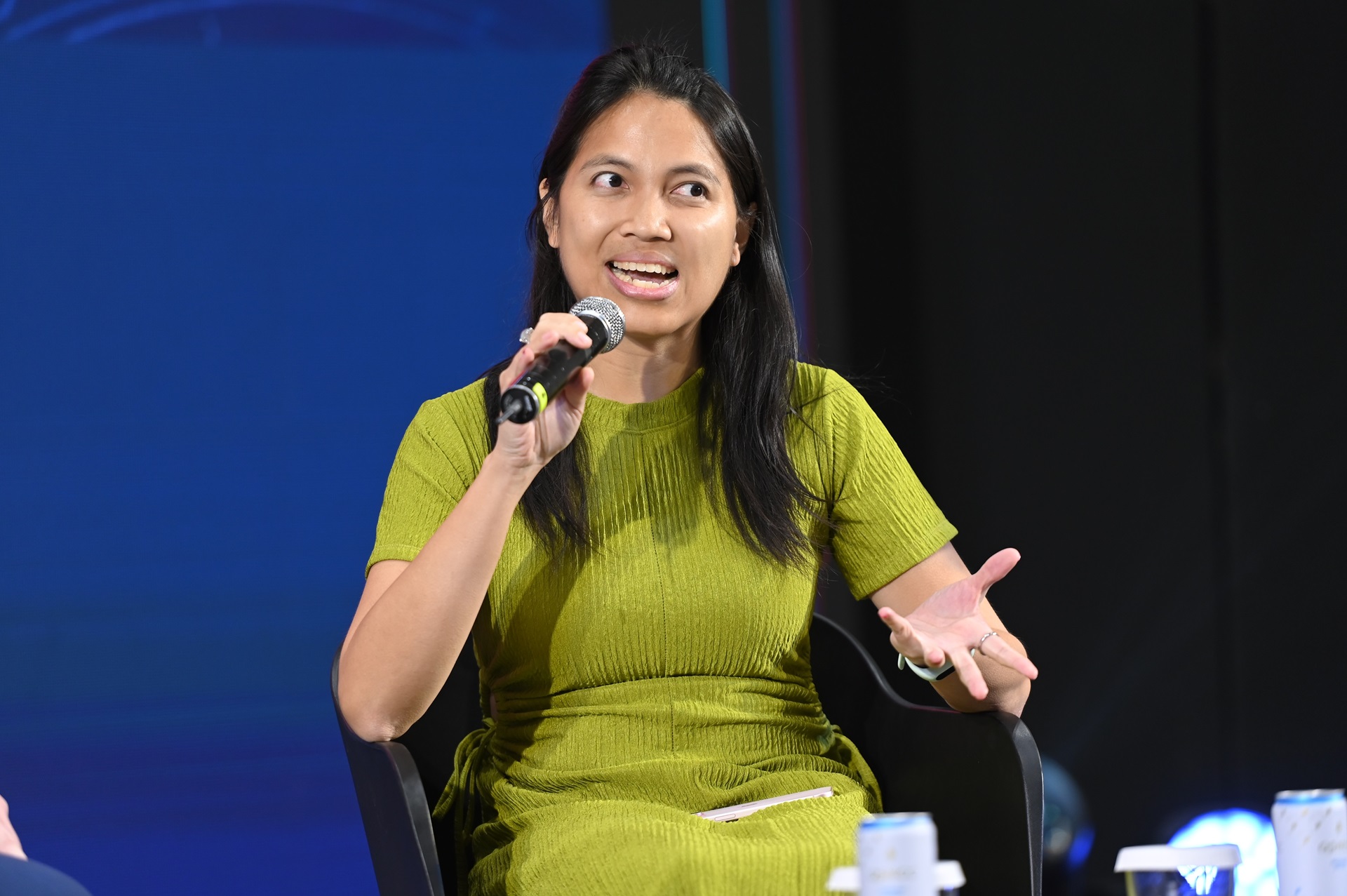 Woman speaking into a mic