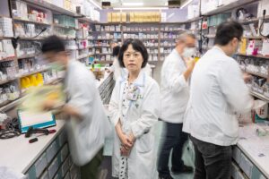 A group of people in a pharmacy