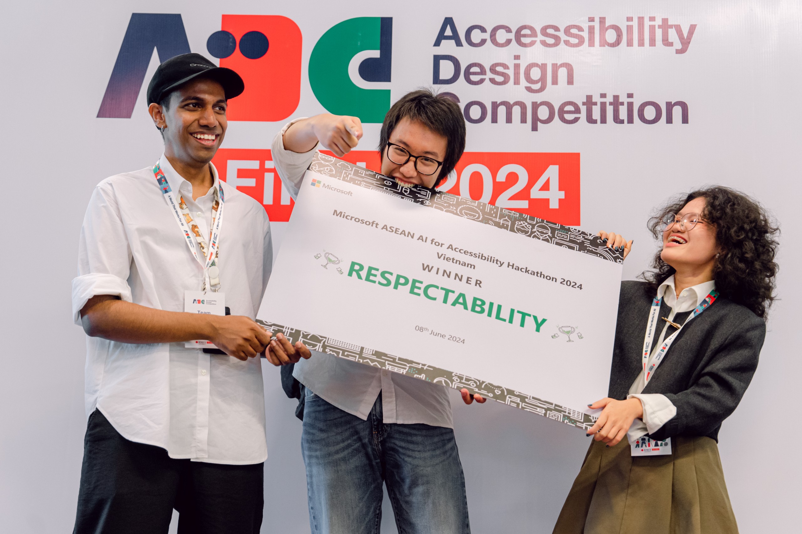 Three members (two men and one woman) of the winner team holding the certificate of Microsoft AI4A Hackathon 2024.