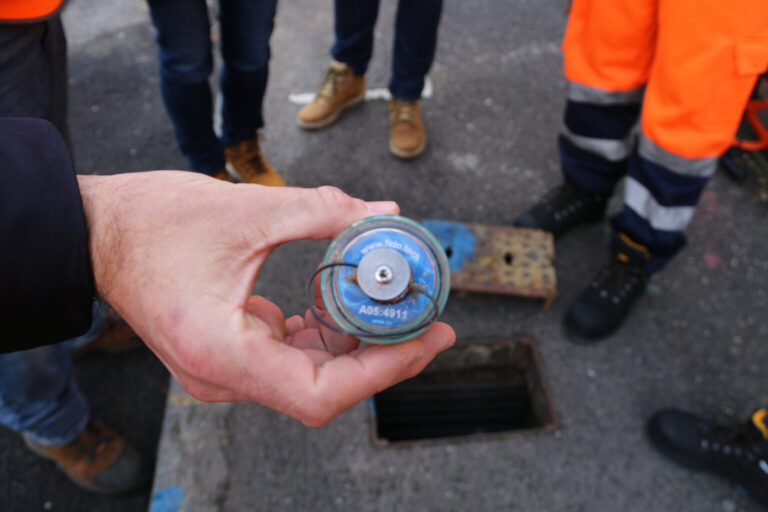 a photo of a hand holding a FIDO sensor