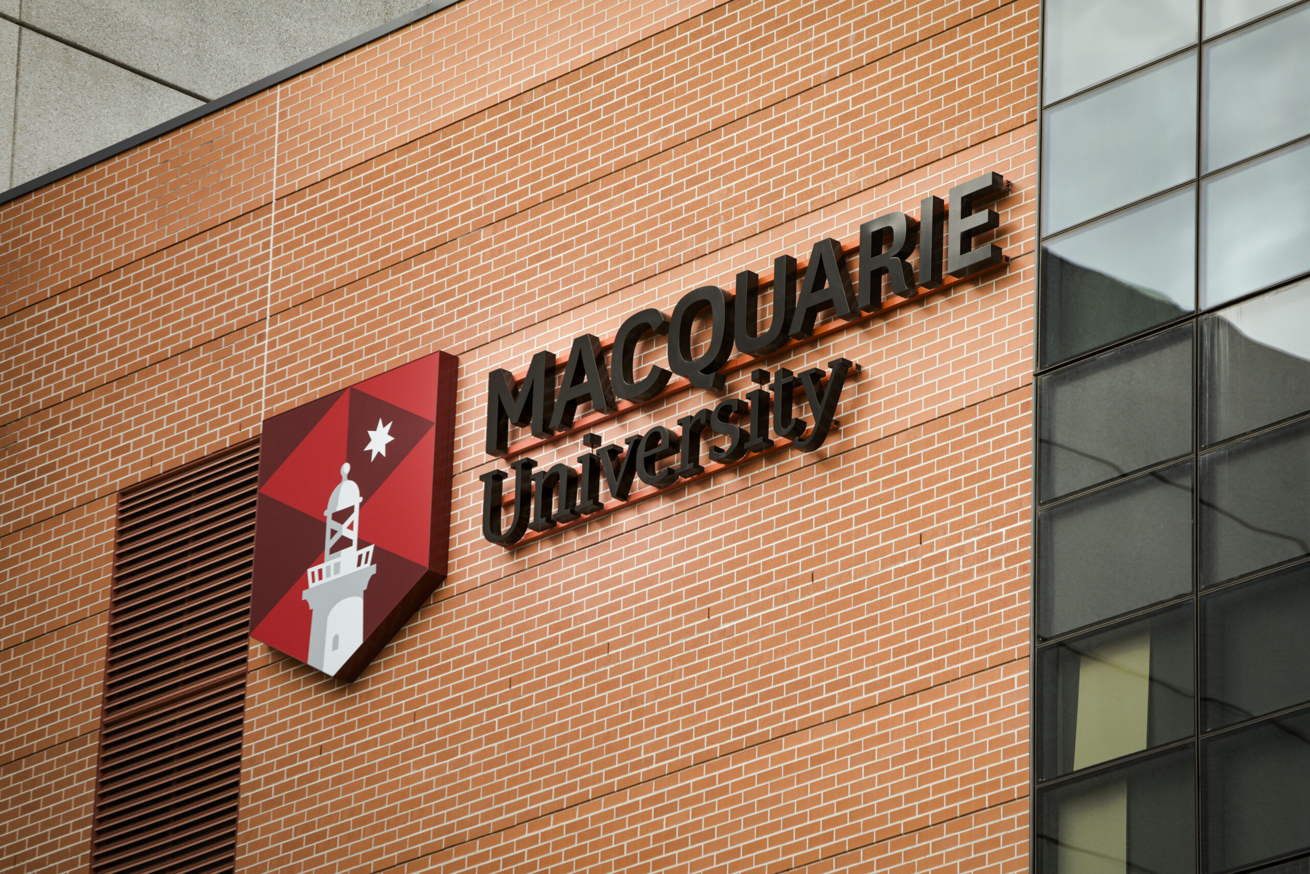Macquarie University logo on a building.