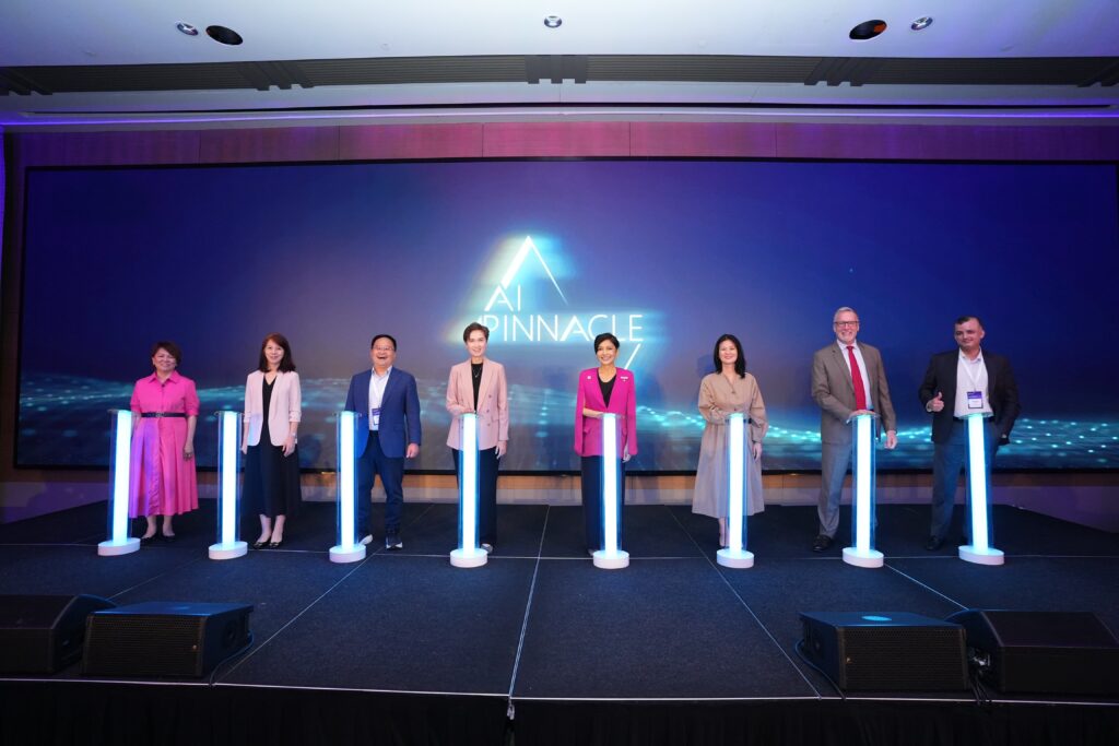 Eight people on stage for the expansion of the Microsoft Singapore AI Pinnacle Program